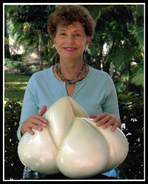 Photograph of Julia Hyman and one of her sculptures